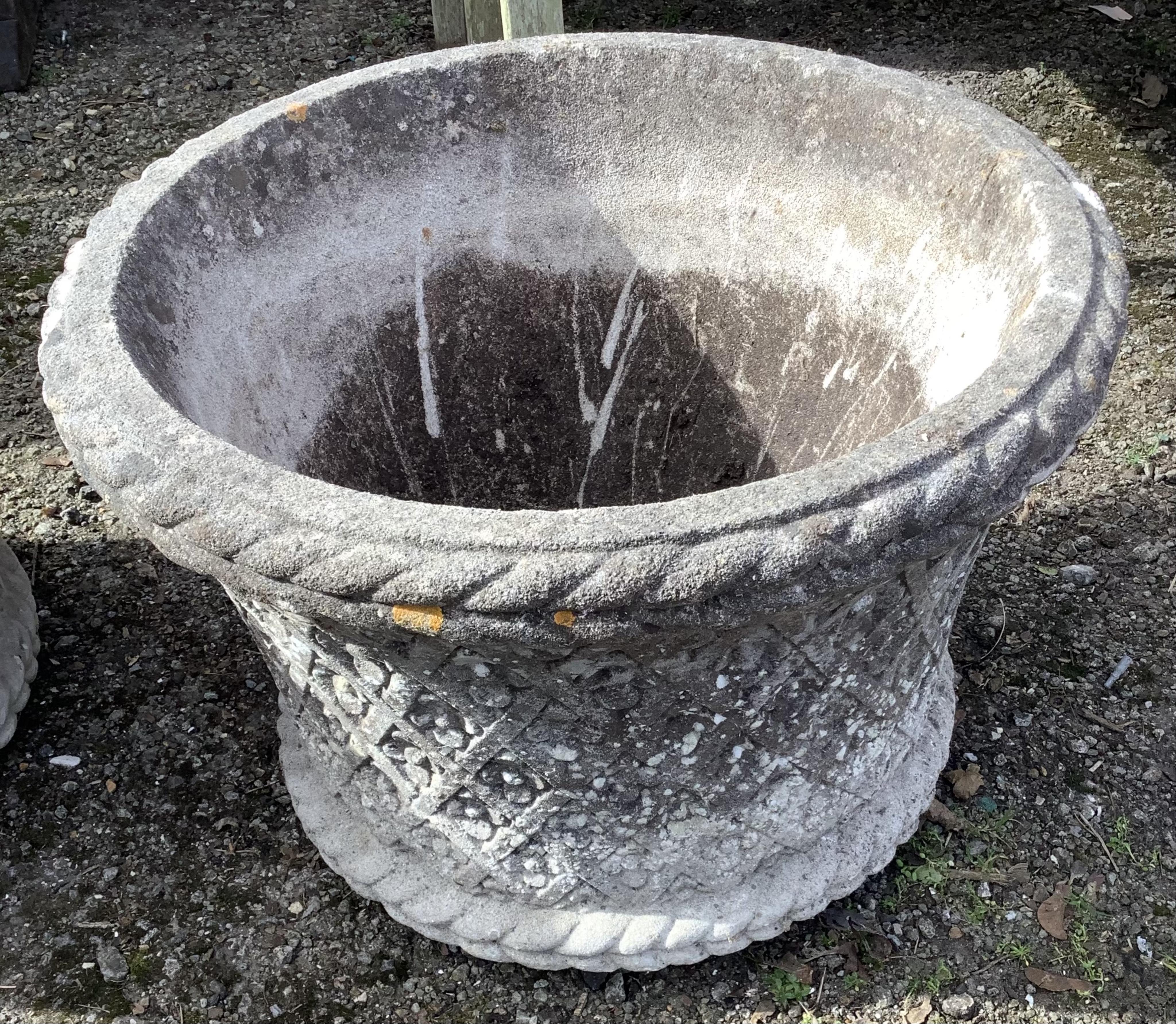 A set of four composition stone planters, modern, each of flowering cylindrical form, moulded with trellis work and flowerheads, diameter 62cm, height 42cm. Condition - good